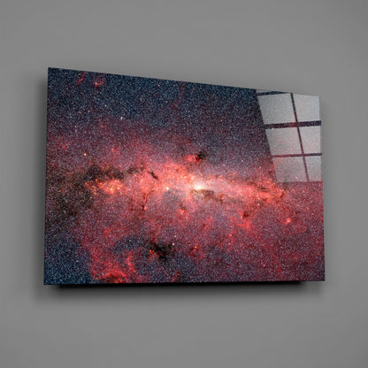 Red Nebula Glass Wall Art displayed at an angle, showing a textured glass panel with red and dark blue cosmic imagery and a grid pattern overlay on the right edge.