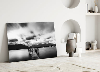 Dramatic Clouds Over Lake Jetty Glass Wall Art