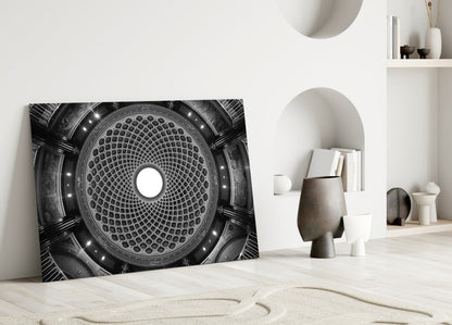 Black and white architectural dome glass art leaning against white wall in minimalist interior setting.