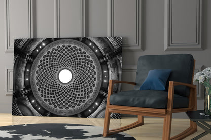 Black and white dome glass wall art featuring geometric circular pattern with central light displayed in modern living room beside wooden chair.
