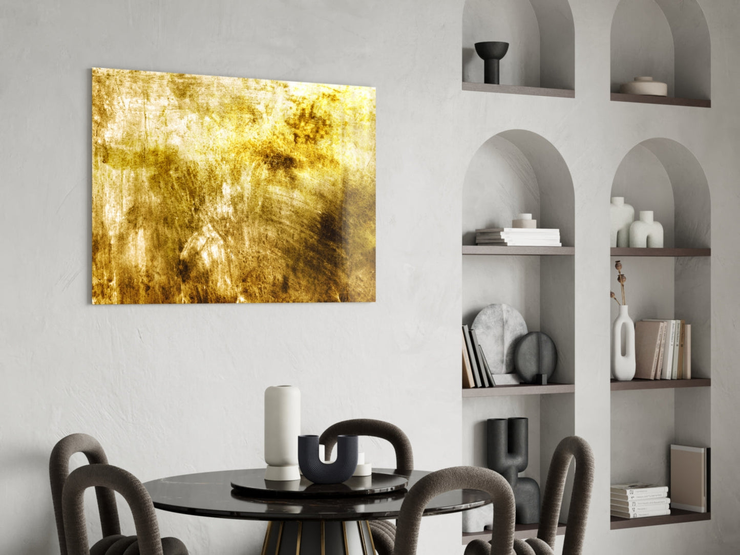 Yellow abstract textured glass art panel displayed above black dining table in modern interior with built-in shelving.