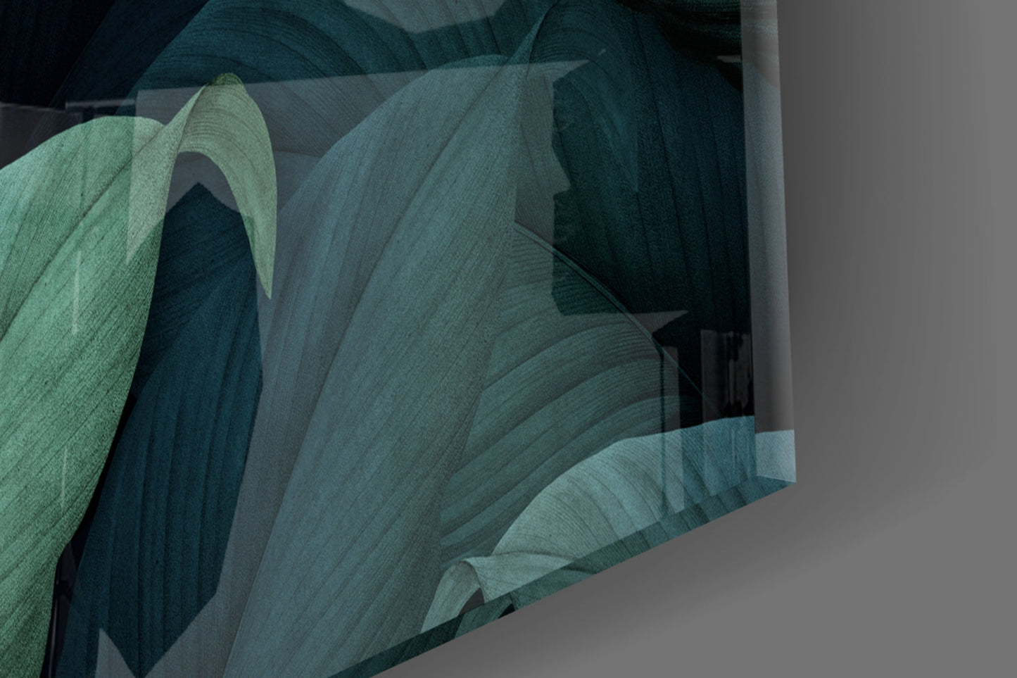 Close-up of layered green and teal glass sheets showing textured leaf forms and overlapping translucent planes against neutral background.