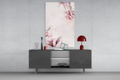 Pink flower pattern glass wall art displayed above dark gray credenza with red lamp and decorative objects on concrete wall.