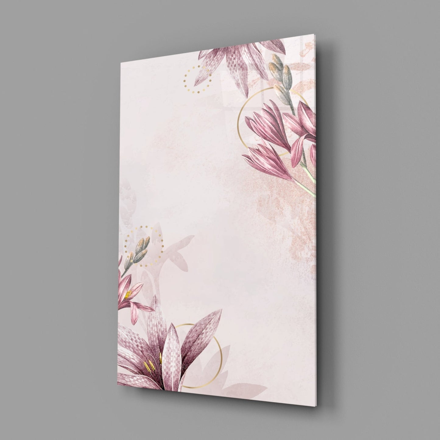 Angled perspective view of glass wall art displaying delicate pink flowers with gold accents on cream background.