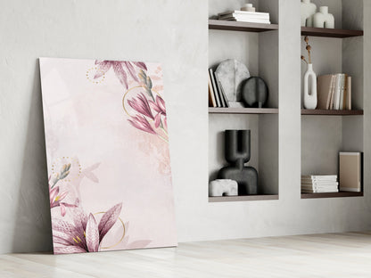 Pink flower glass wall art leaning against white wall beside modern shelving unit with decorative objects.