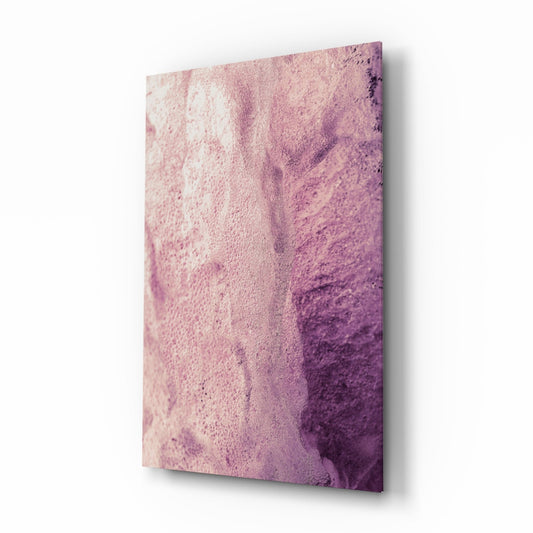 Pink abstract glass wall art panel displaying gradient watercolor effect from pale cream to deep purple, photographed at angle showing depth and shadow.
