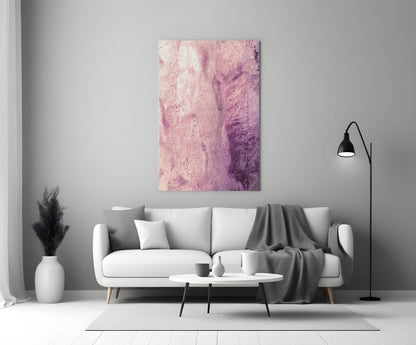 Pink abstract glass wall art with gradient watercolor effect displayed above white sofa in modern living room interior.