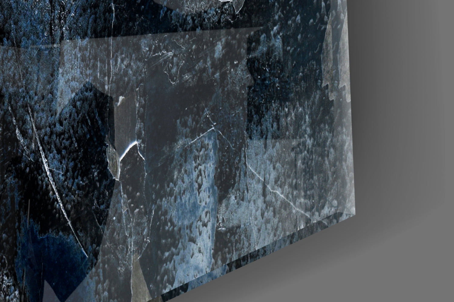 Blue and gray abstract glass panel displayed at an angle, showing textured surface with weathered, mottled finish and white cracks.