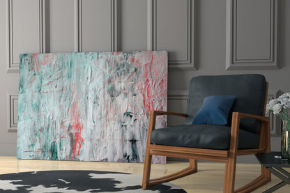 Abstract oil-effect glass wall art with turquoise, pink, and white brushstrokes displayed in modern living room interior.