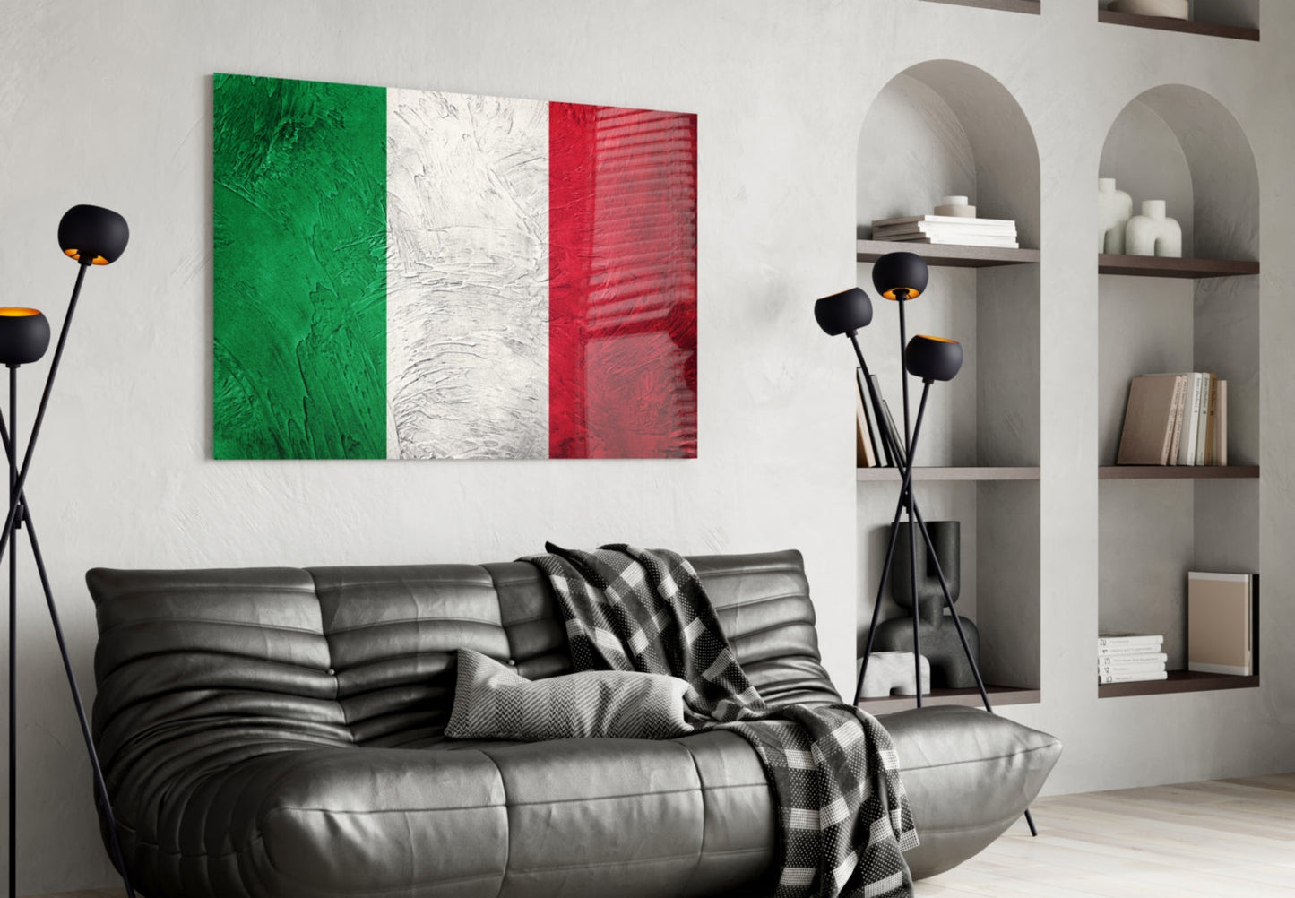 Italian flag glass wall art with green, white, and red vertical stripes displayed above black leather sofa in modern living room.