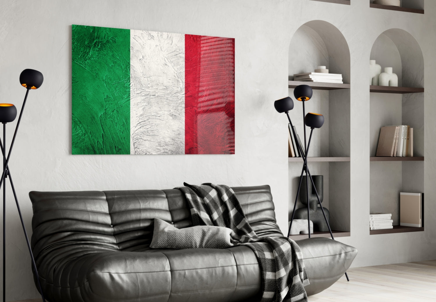 Italian flag glass wall art with green, white, and red vertical stripes displayed above black leather sofa in modern living room.