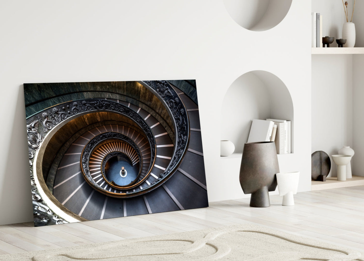 Spiral Glass Wall Art leaning against white wall displays ornate concentric staircase with blue center and golden accents.