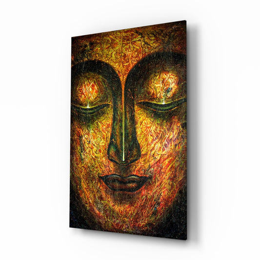 Angled view of glass wall art displaying a serene Buddha face with glowing golden and orange patterned background against dark contours.