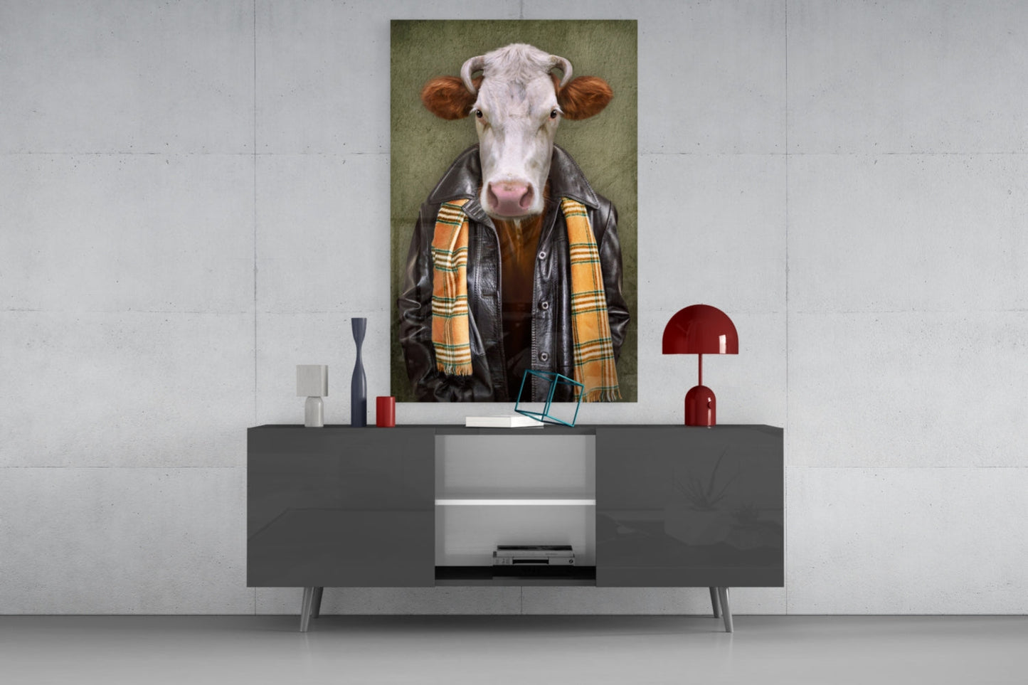Ox Head Glass Wall Art displayed above a dark gray console table, featuring a white cow wearing a black leather jacket and yellow plaid scarf against a green background.