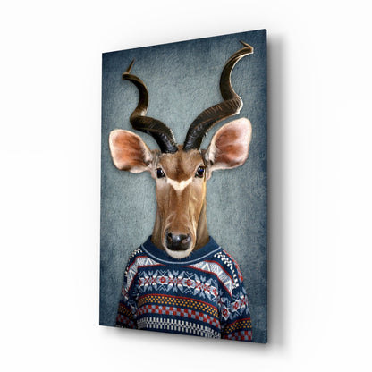 Antelope with spiral horns wearing a patterned blue and red knit sweater against a textured blue-gray background on glass.