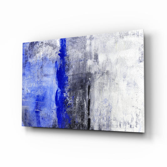 Modern glass wall art panel displaying vertical cobalt blue stripe transitioning through gray and white weathered textures, angled three-quarter view.