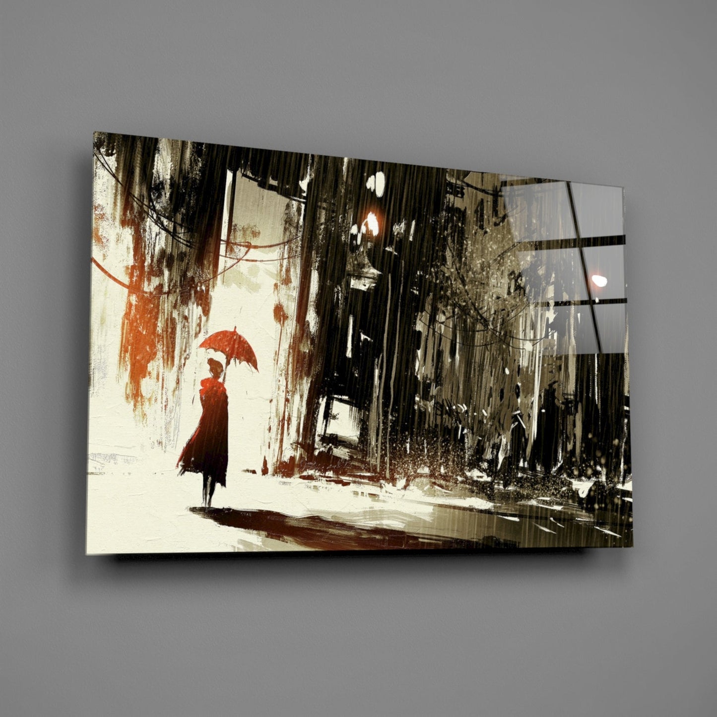 Glass wall art panel displaying an illustrated rainy street scene with a figure holding a red umbrella against weathered urban buildings.