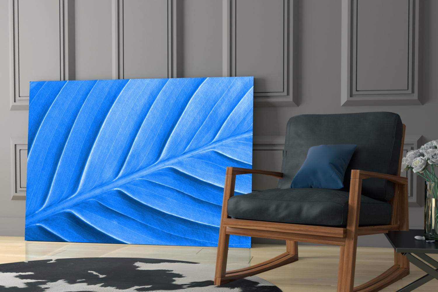 Blue Leaf Glass Wall Art displayed in modern living room setting beside wooden chair with black cushions and white flowers.