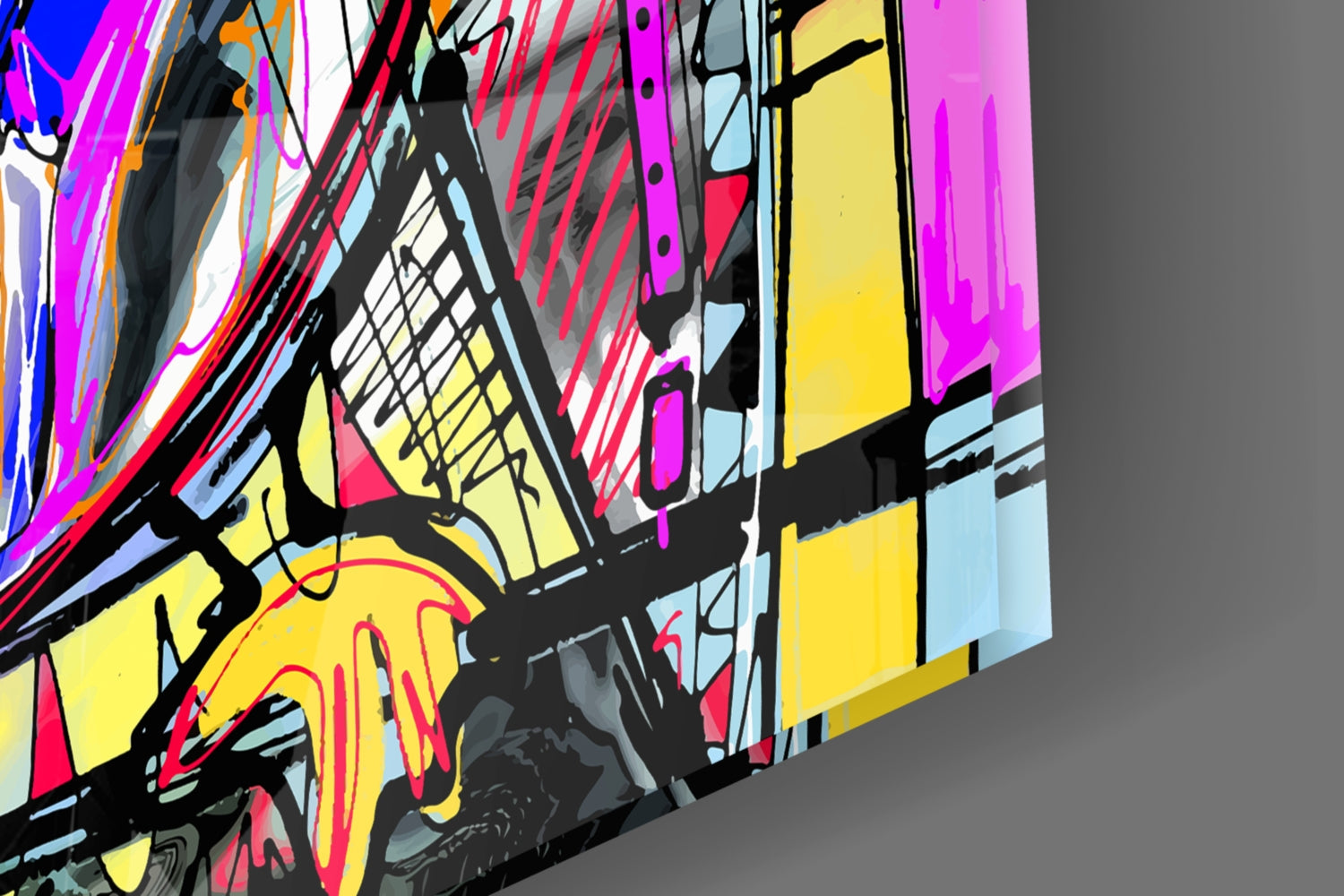 Colorful abstract glass wall art featuring vibrant geometric shapes in magenta, yellow, red, and blue with bold black outlines, photographed at an angled perspective against gray background.