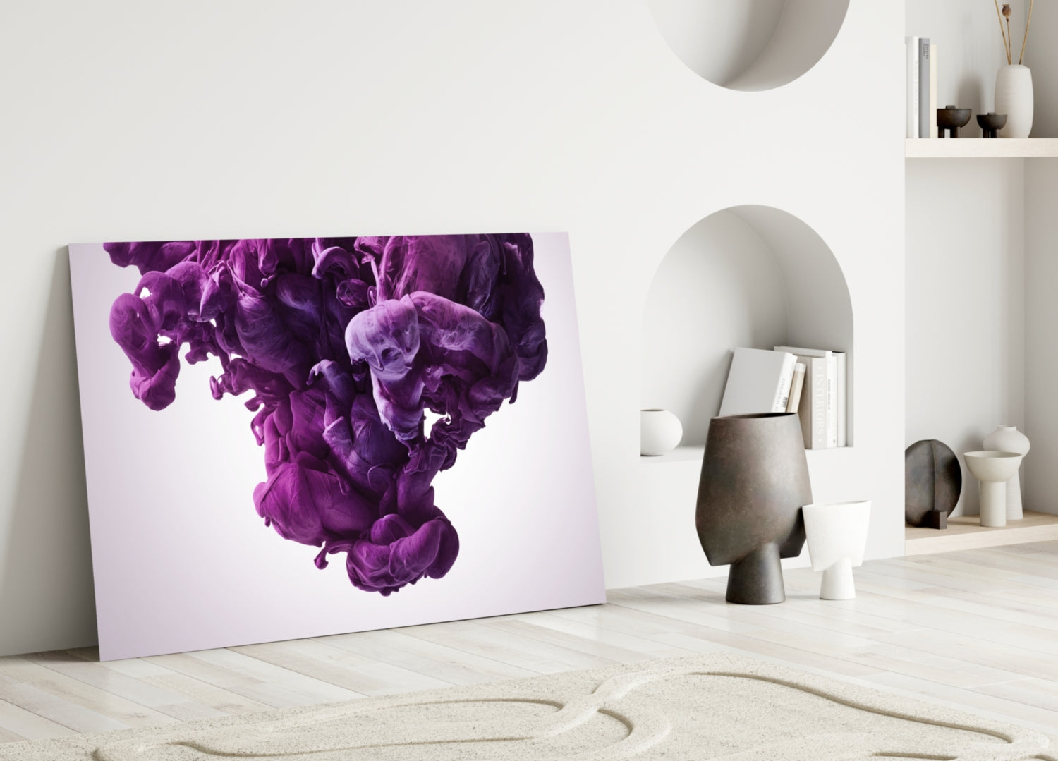 Purple smoke glass wall art leaning against white wall in minimalist interior with decorative objects and shelving.