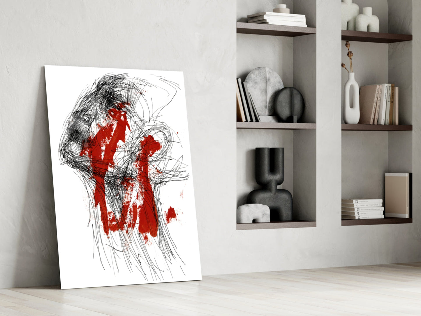 Abstract glass art leaning against white wall featuring black sketch lines with red paint splatters, displayed in minimalist interior setting.