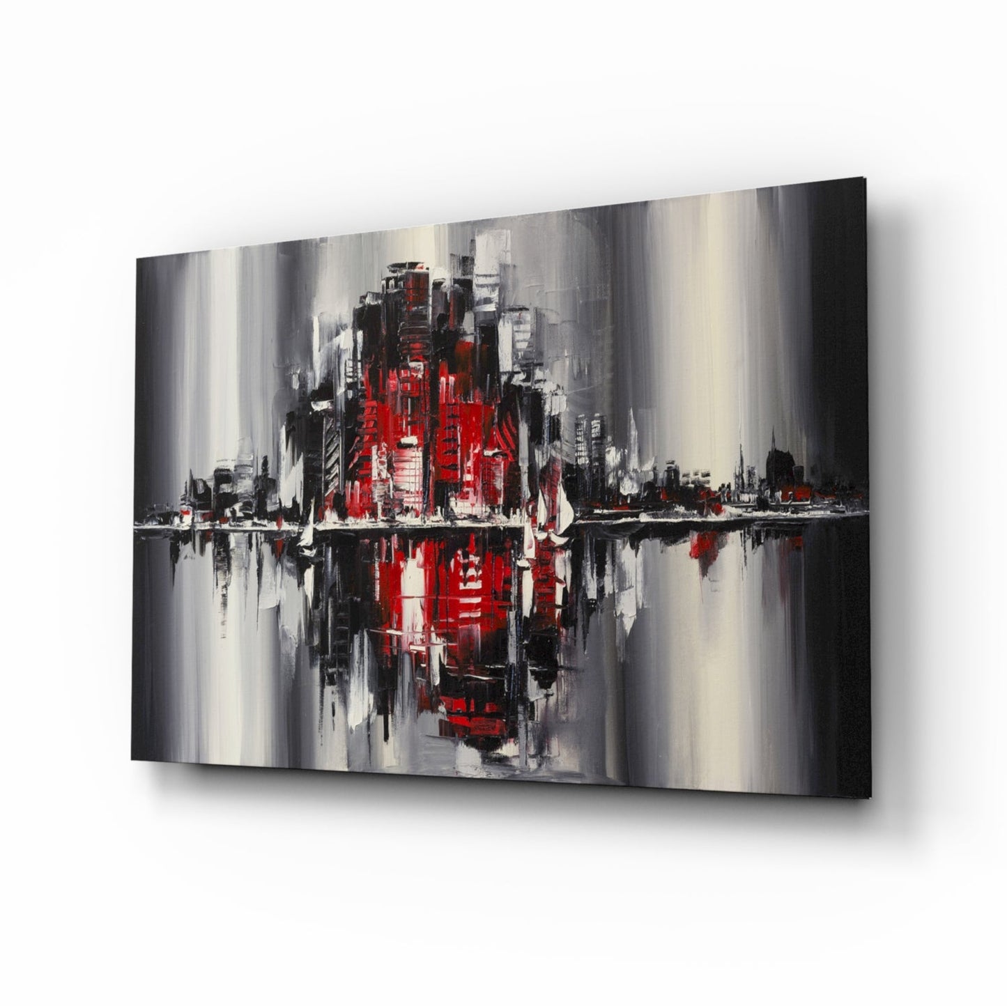 Abstract cityscape glass wall art featuring red and black buildings with gray streaks and mirrored water reflection effect, displayed at angle.