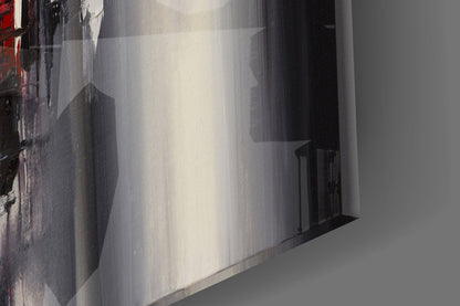 Glass wall art panel displaying urban alleyway with brick buildings and dramatic shadow reflections in grayscale tones.