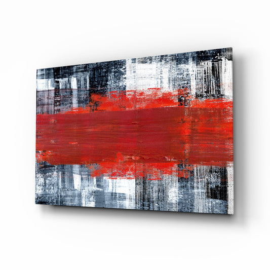 Abstract glass wall art with red horizontal brushstroke over gray and white distressed texture, photographed at three-quarter angle.