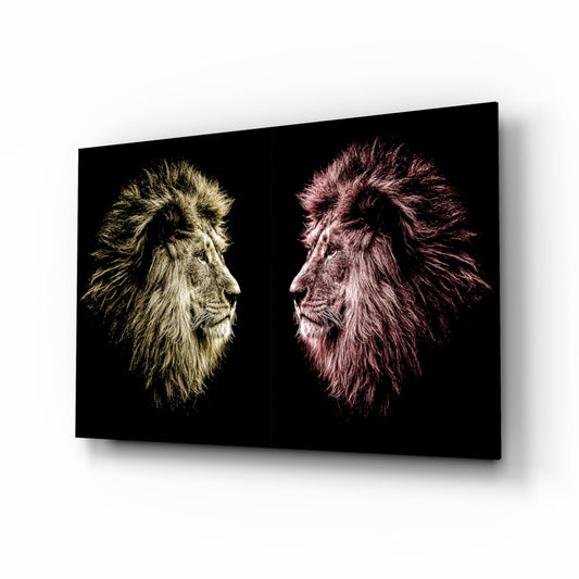 Two lion heads in profile facing each other on black glass, one rendered in gold tones on the left, one in pink tones on the right.