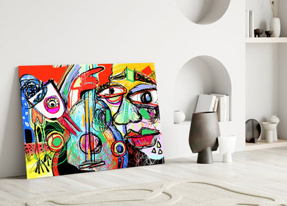 Vibrant multicolored abstract glass art leaning against white wall in minimalist room setting, featuring bold geometric shapes and expressive linework.