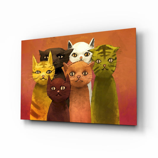 Six stylized cats in yellow, black, white, brown, and green against an orange-to-pink gradient background on glass wall art, displayed at an angle.
