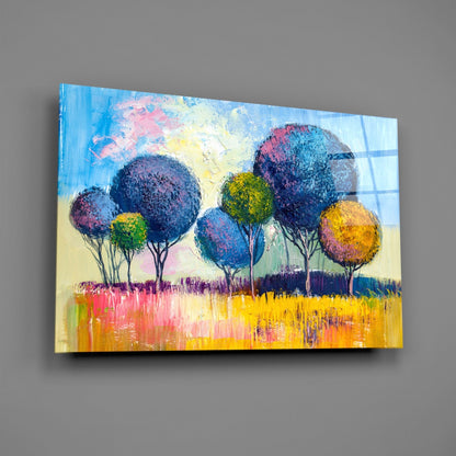 Colorful glass wall art depicting stylized trees with dark foliage against a bright yellow and pink wildflower field under a blue sky.