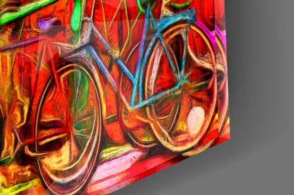 Close-up detail of vibrant glass wall art featuring swirling red, orange, yellow, and blue abstract patterns with reflective surfaces.