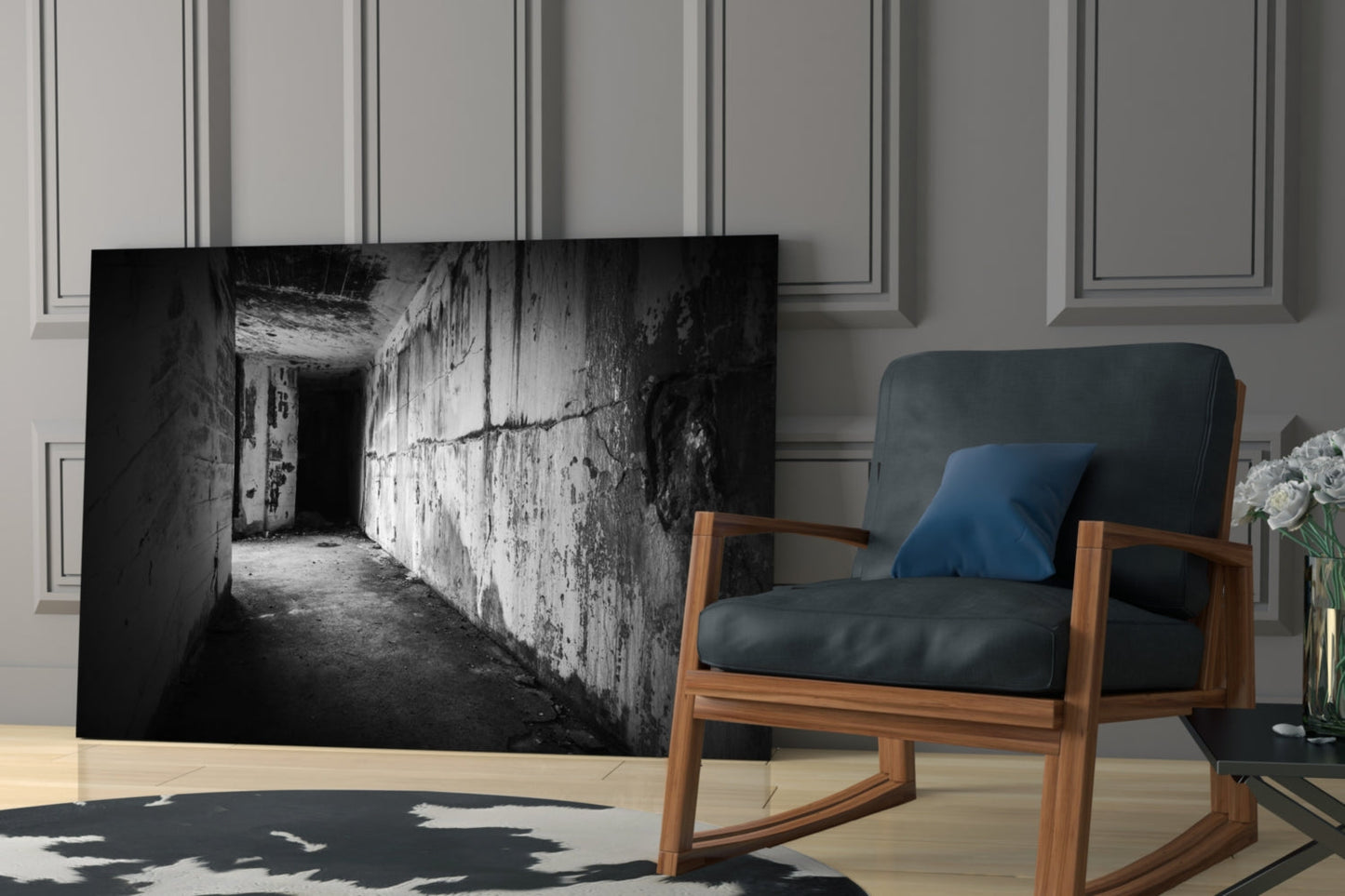Black and white glass wall art depicting a deteriorating concrete hallway with peeling walls and shadowed passage, displayed in modern living room setting.
