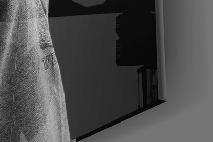 Black and white angled view of Lion Head Glass Wall Art mounted on textured wall, showing profile silhouette and glass edge detail.