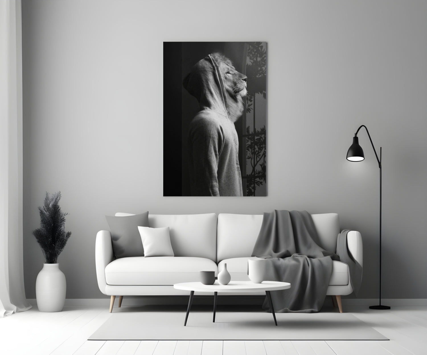 Black and white lion head profile glass wall art displayed above a white sofa in a minimalist living room interior.