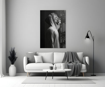 Black and white lion head profile glass wall art displayed above a white sofa in a minimalist living room interior.
