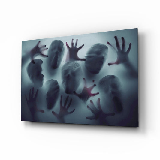 Angled perspective of frosted glass wall art displaying blurred silhouettes of multiple figures with raised hands against a teal-grey gradient background.