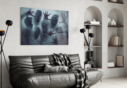 Silent Scream glass wall art hanging above gray leather sofa in modern living room with shelving and black floor lamp.