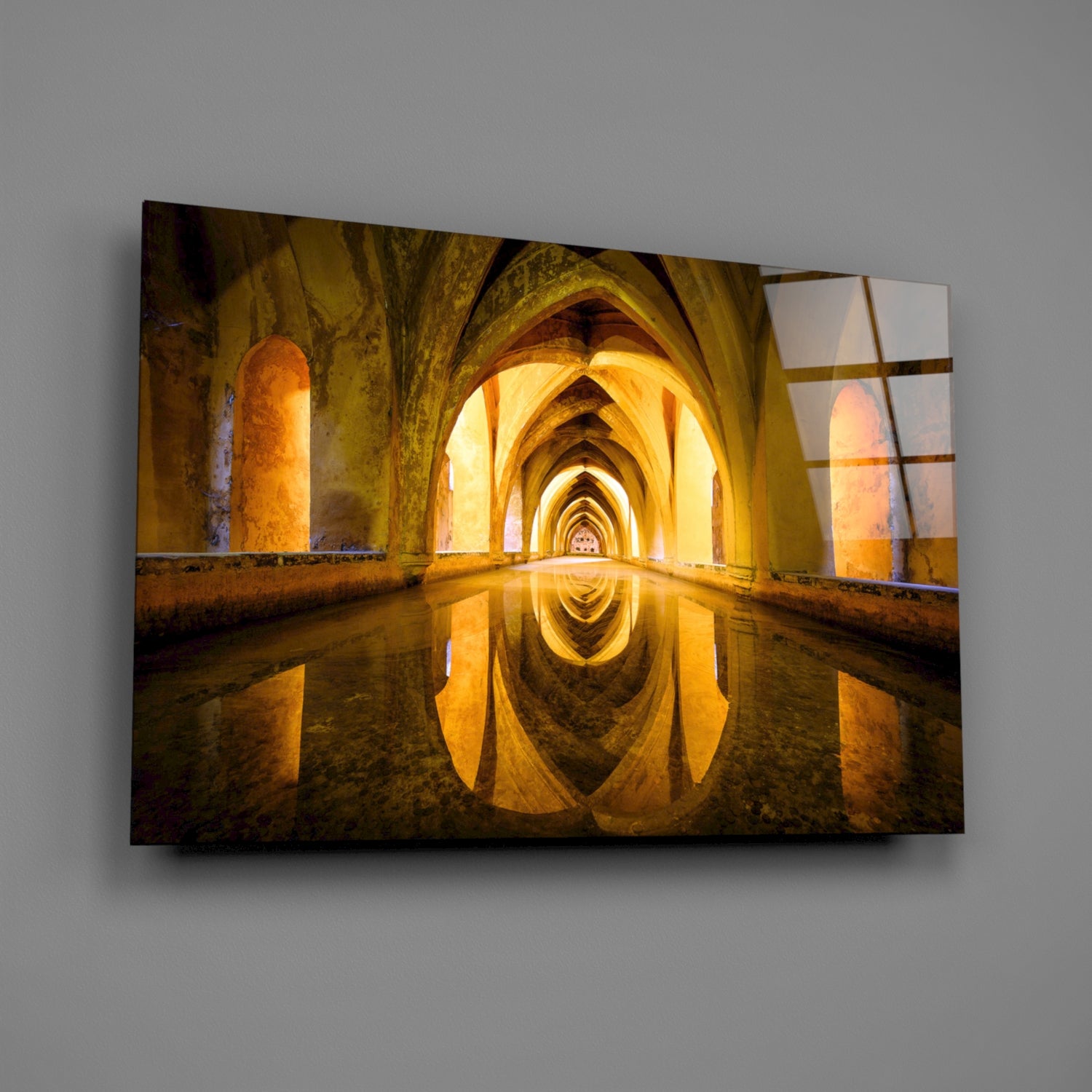 Glass wall art displaying an illuminated arched stone corridor with golden lighting and water reflection.