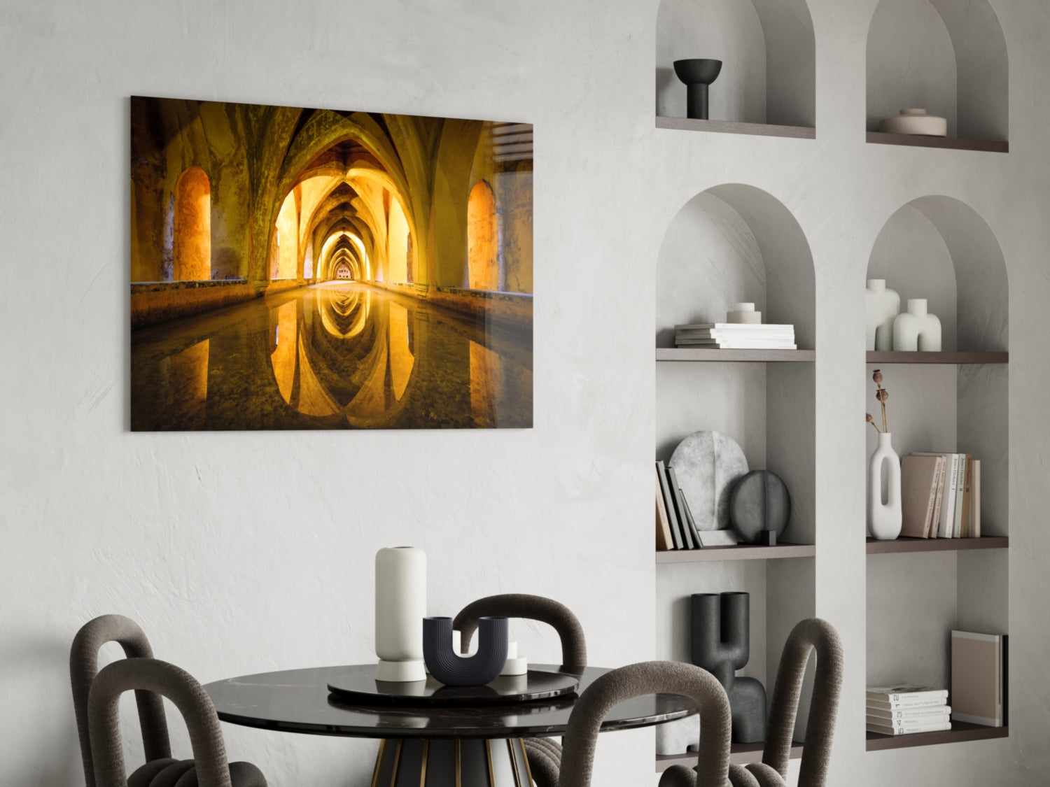 Golden-lit arched tunnel with water reflection displayed as framed wall art above a black dining table with grey chairs.