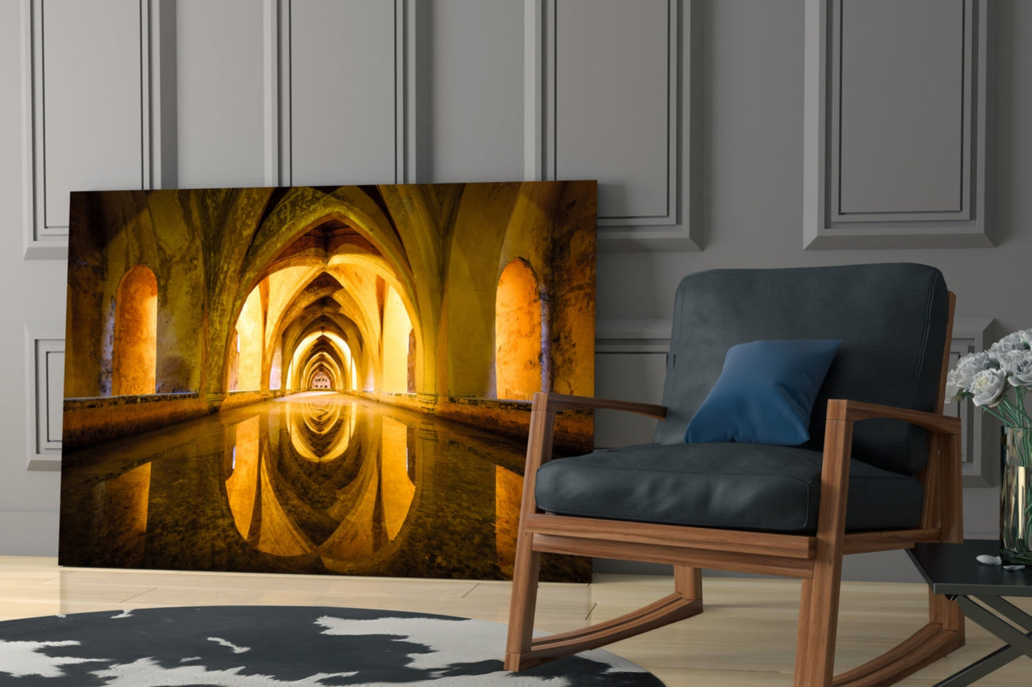 Glass wall art depicting golden-lit underground cistern with arched stone corridors and water reflection, displayed in modern living room setting.