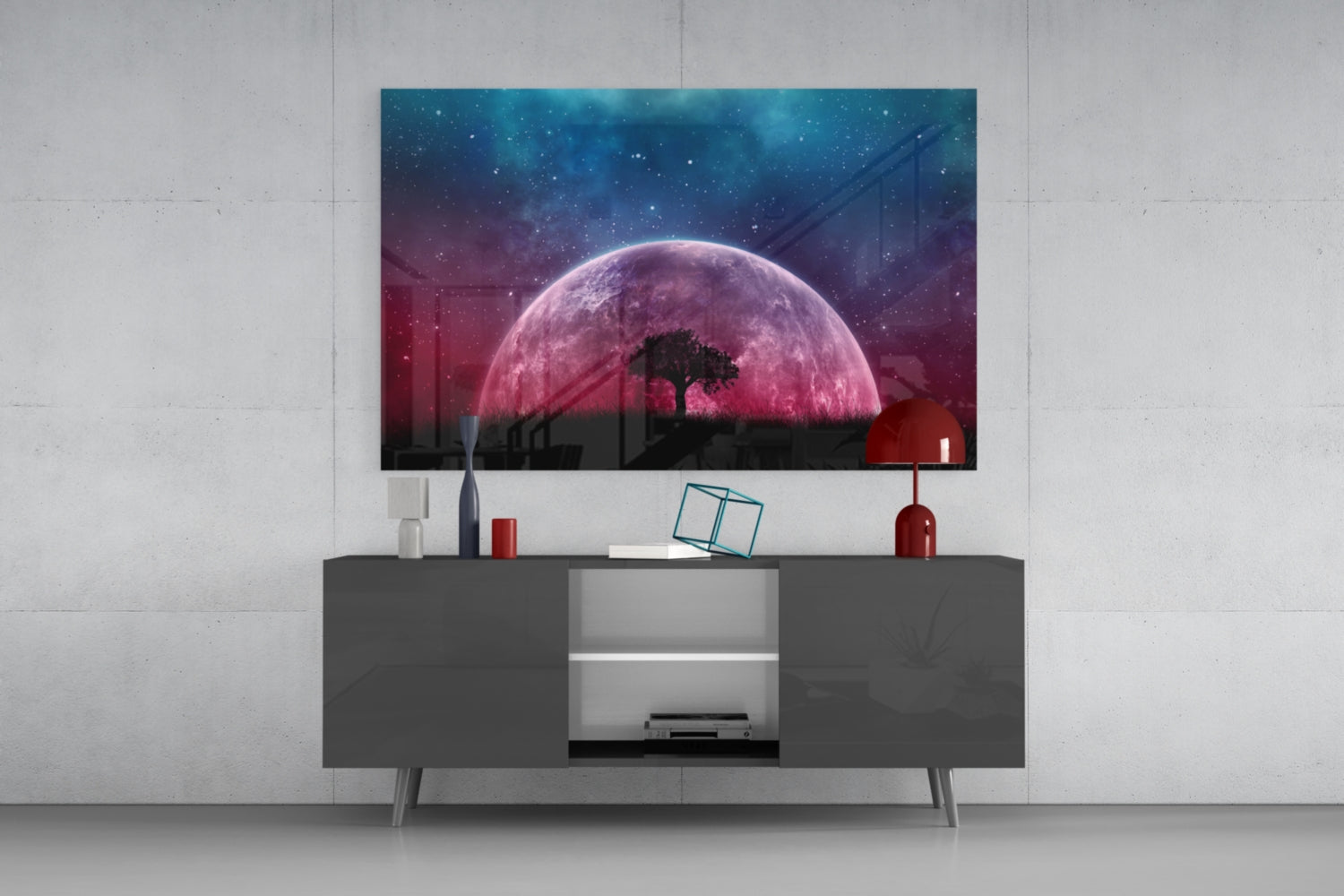 Mystical Night Glass Wall Art displayed on a gray media console, showing a pink moon with silhouetted tree and starry sky backdrop.