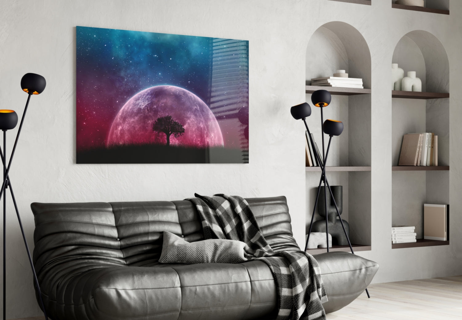 Mystical Night Glass Wall Art displayed above a gray sofa in a modern living room with built-in shelving and black floor lamp.