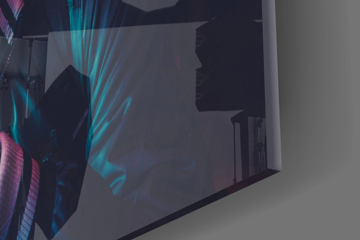 Be quiet! glass wall art displayed at an angle showing silhouetted figure with turquoise and purple lighting effects against dark background.