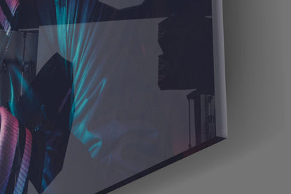 Be quiet! glass wall art displayed at an angle showing silhouetted figure with turquoise and purple lighting effects against dark background.