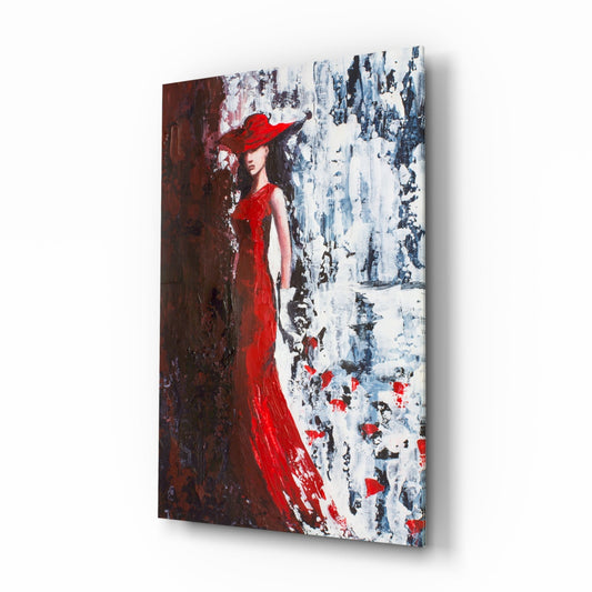 Glass wall art panel displaying a woman in a red gown and hat against textured brown and white background, angled three-quarter view.