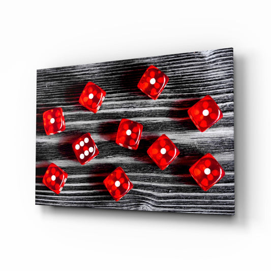 Red translucent dice with white dots scattered across black wood grain textured glass panel, angled perspective view.