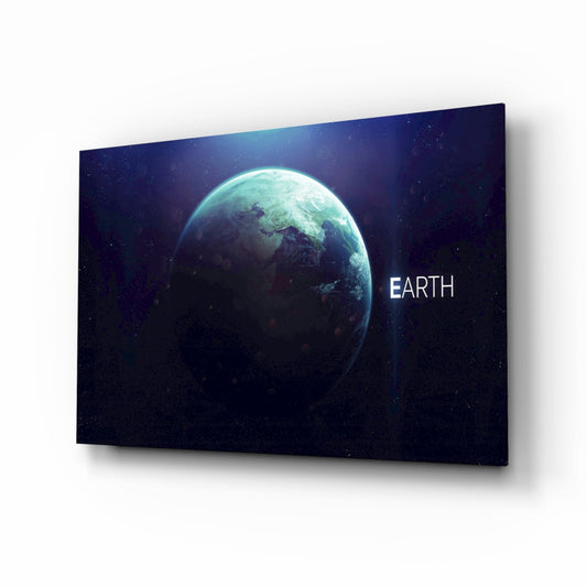 Angled three-quarter view of glass wall art displaying glowing turquoise Earth against dark starry background with "EARTH" text.