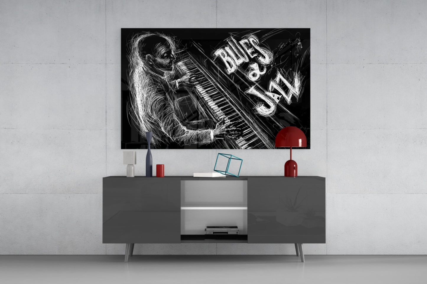 Black and white jazz blues glass wall art mounted above gray media console, featuring illustrated monkey at piano with "BLUES & JAZZ" text and red accent circle.